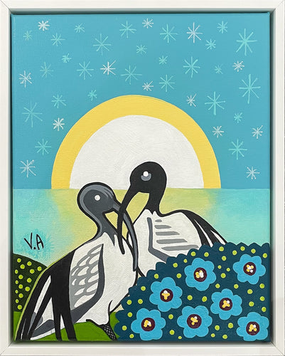 Stylised, colourful painting of two ibis on the edge of the ocean surrounded by flowers and a starry sky.