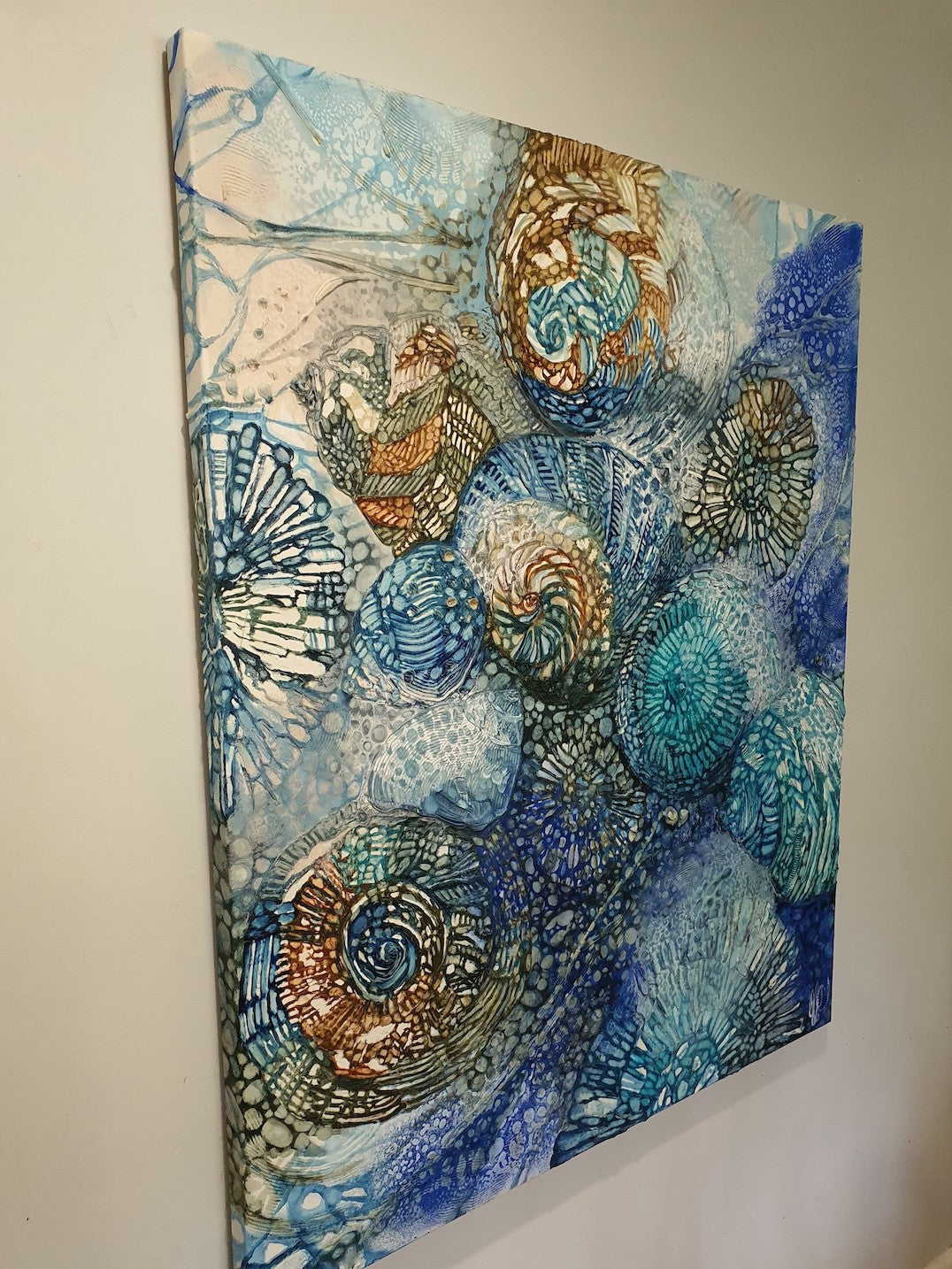 Side view of an original artwork in stunning shades of yellow, blue and turquoise. This painting is a celebration of the delicate and beautiful natural rock pools on the NSW South Coast, and intertidal life being cleansed with the change of tides. 