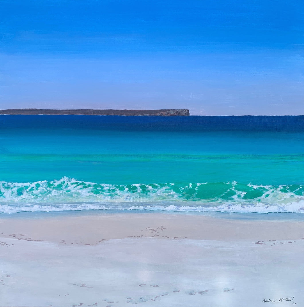 Andrew McPhail Jervis Bay Jewel, An iconic view across the bay from the white sand of Hyams Beach to the sheer cliffs of Point Perpendicular. The swell rolls in and shifts the reflections under the water to create a rainbow of colours.