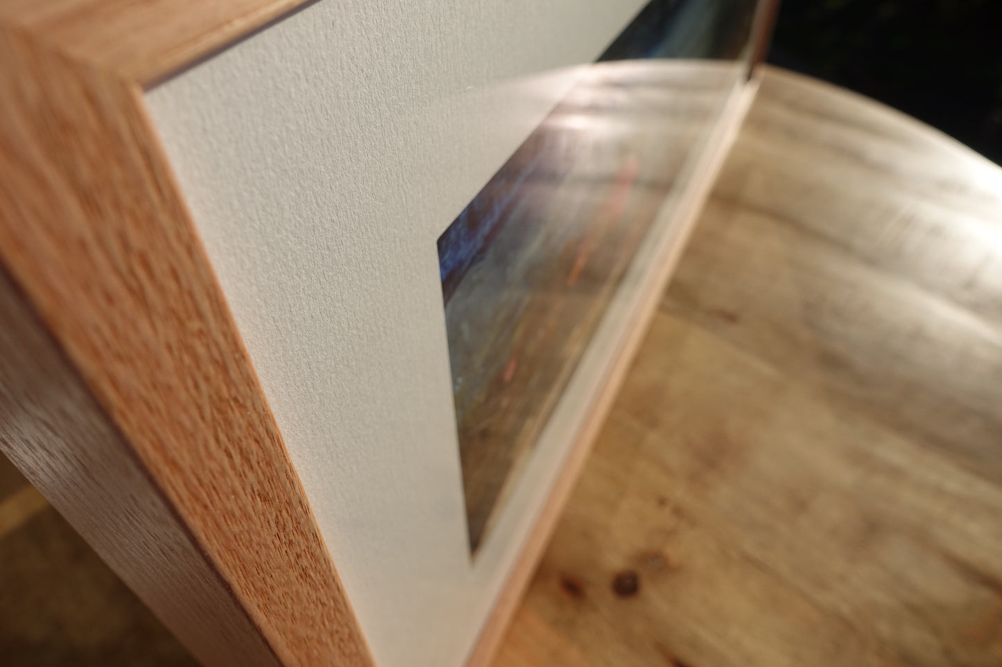 Kiama pine trees and a view to the ocean painted in an abstract style. Close-up of frame.