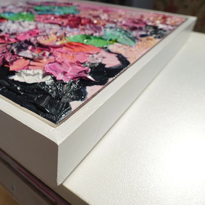 Cloase up view of an original painting of blooms in lollipop pastel shades.