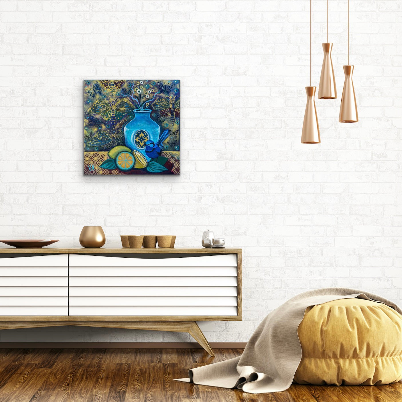Still life in acrylic and oil. Blue and gold with a blue vase, blue bird and cut lemons and limes on a table. Shown on a white brick wall.