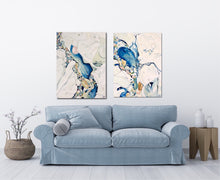 Load image into Gallery viewer, Abstract painting in shades of blue and oyster white with small multicoloured pieces. In situ with matching artwork.
