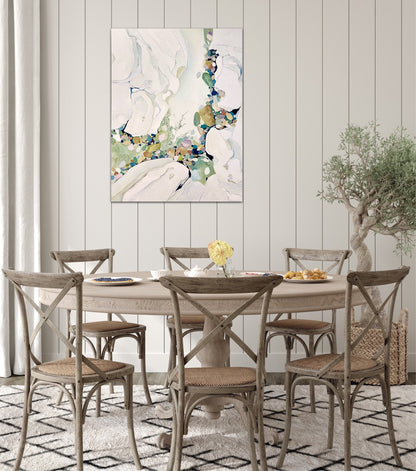 Abstract painting in shades of sea green and oyster white with small multicoloured pieces. In situ on a panelled wall.