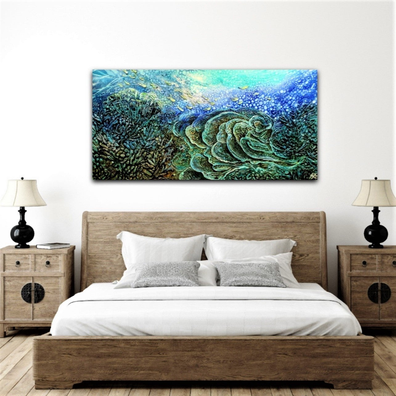 Original oil painting of an underwater reef in beautiful shades of blue, aqua, turquoise, yellow and green. Shown here on a bedroom wall.