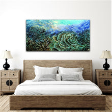 Load image into Gallery viewer, Original oil painting of an underwater reef in beautiful shades of blue, aqua, turquoise, yellow and green. Shown here on a bedroom wall.
