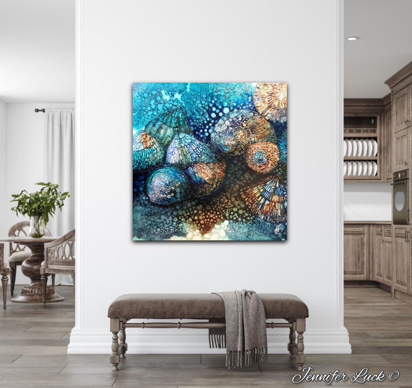Rockpool shells in shades of turquoise, aqua and ochre. Shown on white wall.
