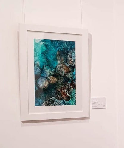 Underwater rocks in shades of blue, aqua and turquoise. Limited edition print on gallery wall.