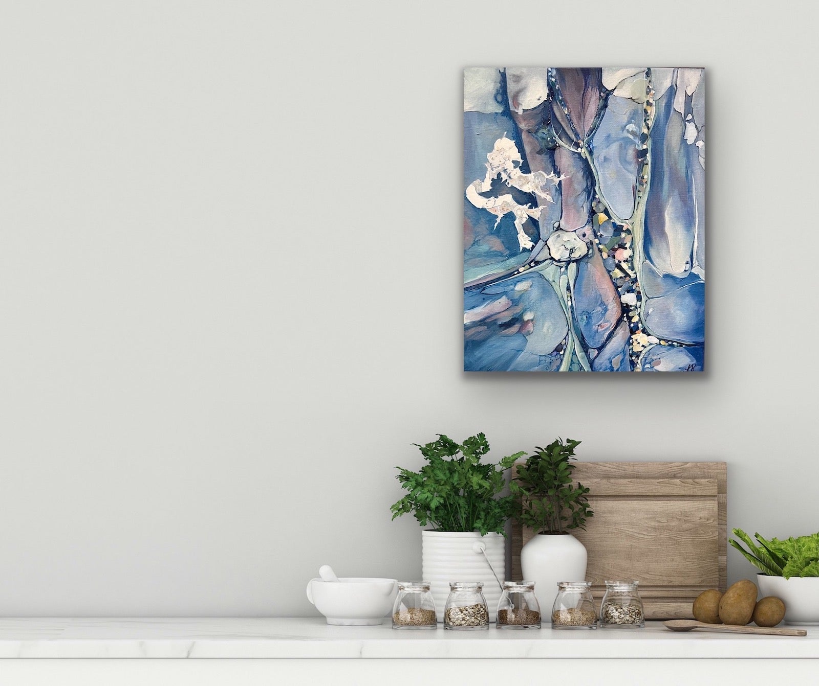Abstract painting in shades of medium blue. In situ on a pale grey wall.