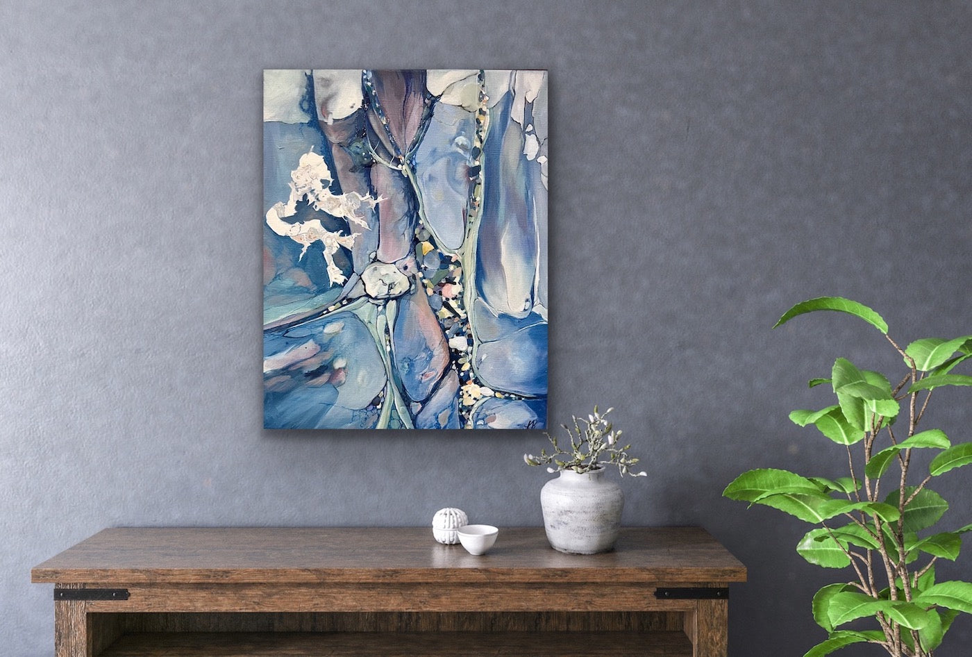 Abstract painting in shades of medium blue. In situ on a lilac wall.