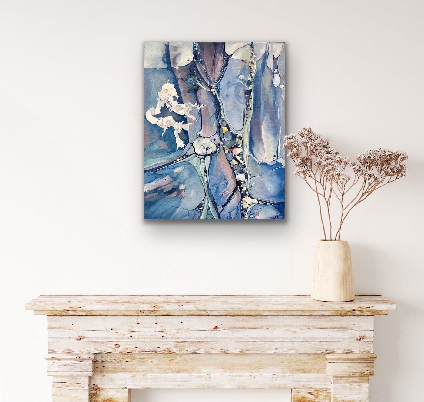 Abstract painting in shades of medium blue. In situ on a white wall.