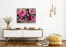 Load image into Gallery viewer, Three iris blooms in shades of pink against an olive green, sage green charcoal and black background. Shown on a white brick wall.
