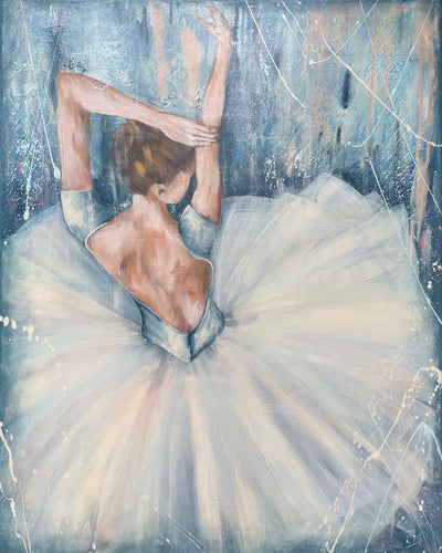 A single ballerina in a gorgeous white tutu in front of a blue pastel background.
