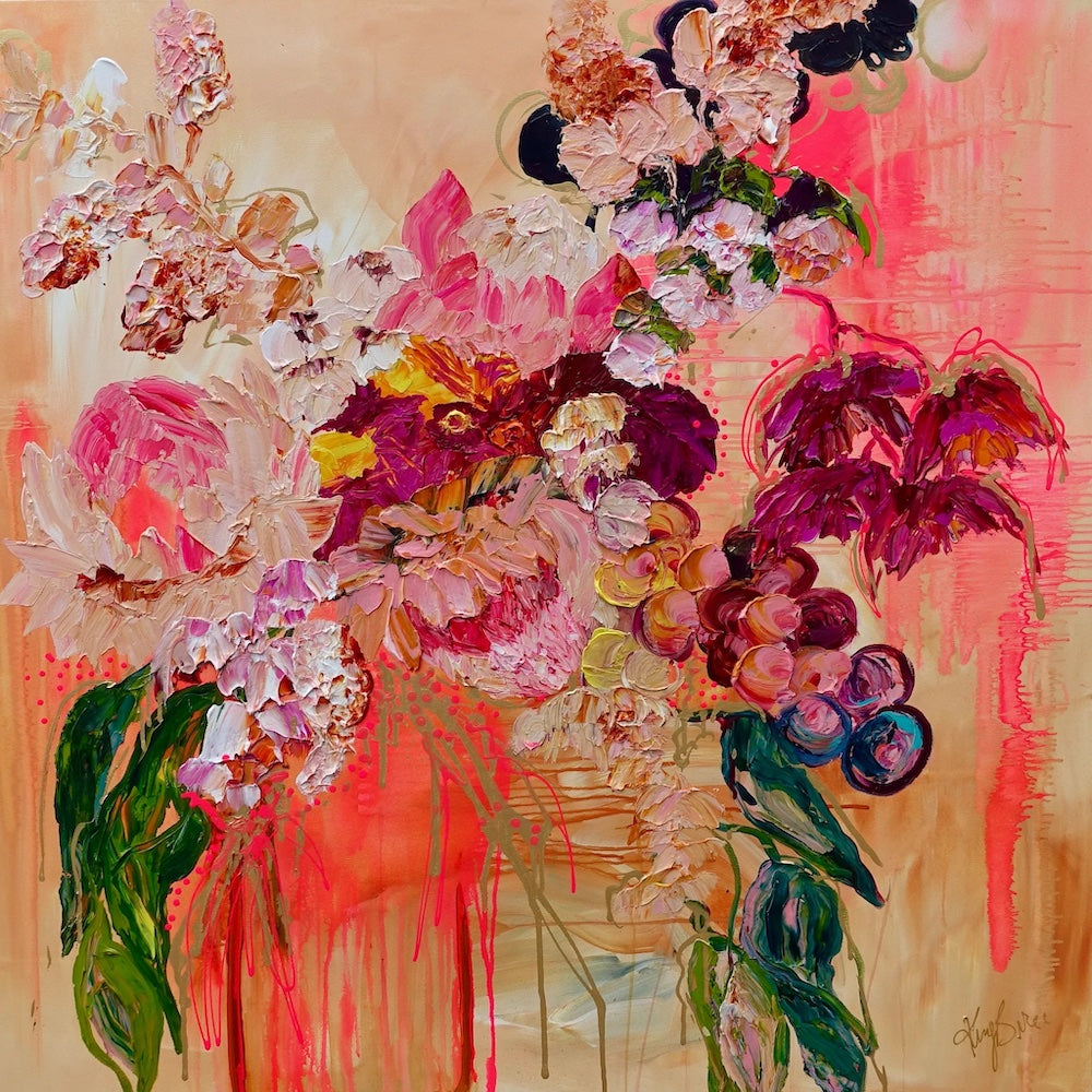 Abundance of blooms in pale pink, hot pink, burgundy and cream with splashes of bright orange on a pale apricot background.