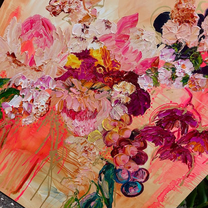 Abundance of blooms in pale pink, hot pink, burgundy and cream with splashes of bright orange on a pale apricot background. Detail view 2.