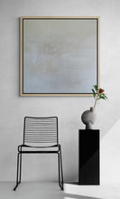Load image into Gallery viewer, A white on white abstract painting. Within the painting are words and marks. Shown in situ  on a white wall.
