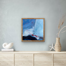 Load image into Gallery viewer, Sailing boat with a pale blue sail and a red hull against a blue sky and a deep blue ocean. In situ view.
