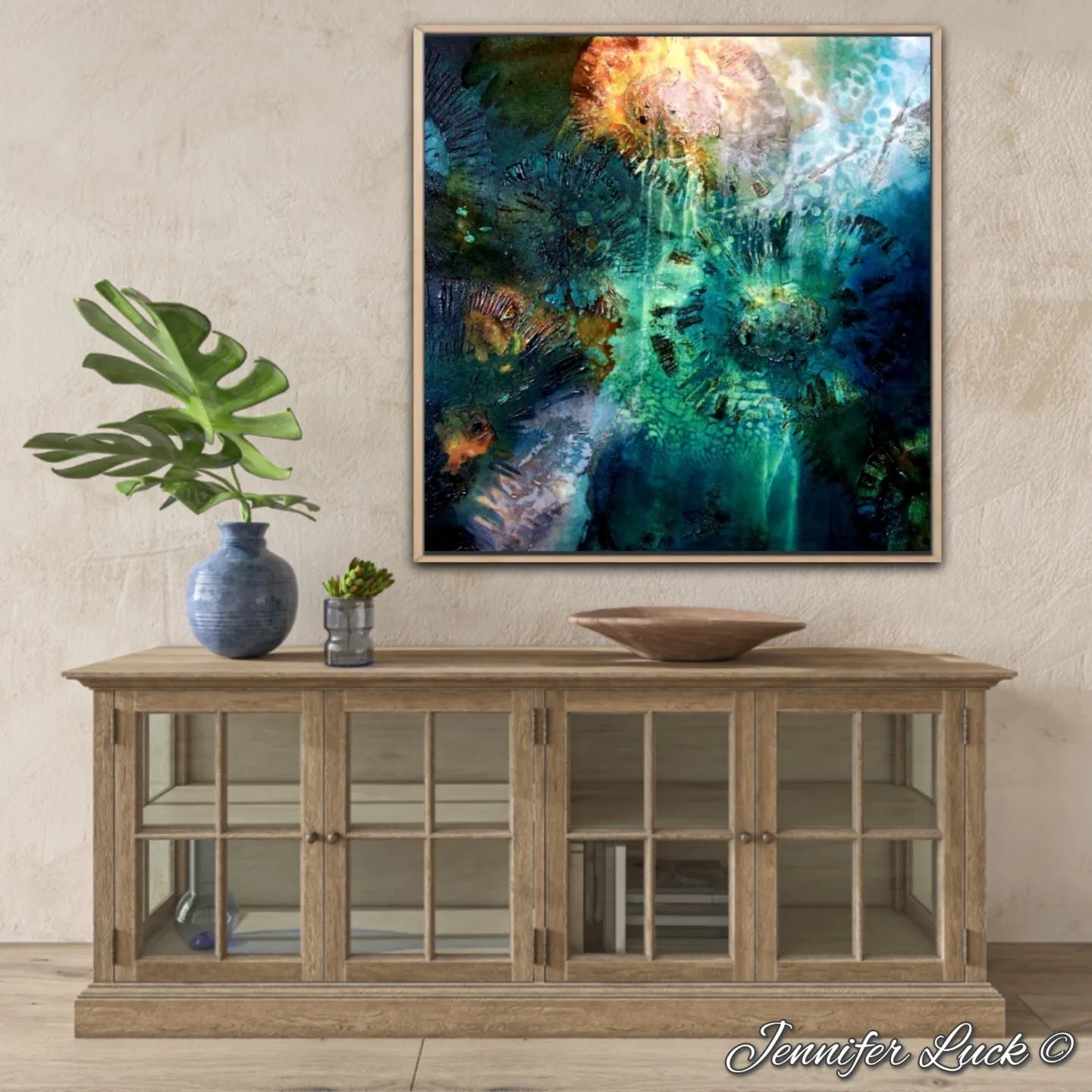 Multi-coloured painting of an ocean pool. Shown in situ above a timber sideboard.