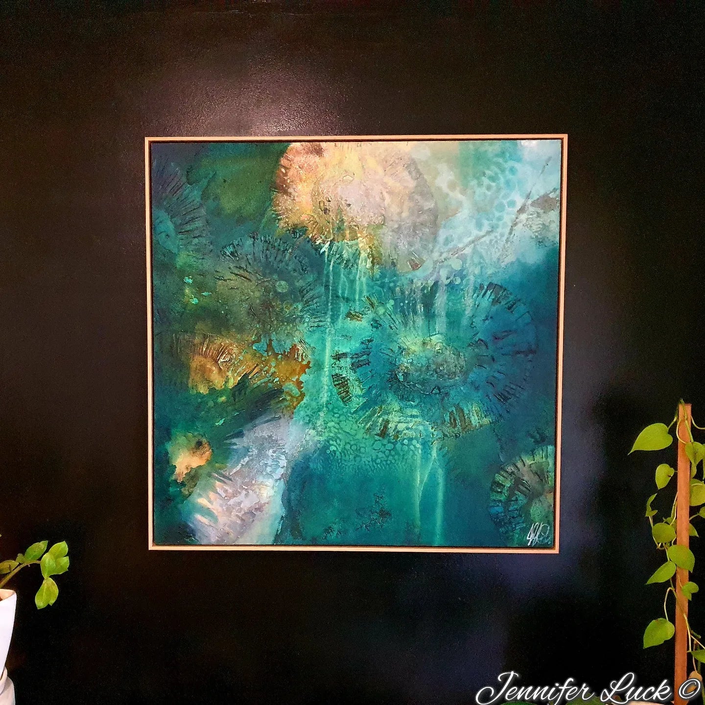 Multi-coloured painting of an ocean pool. Shown in situ on a black wall.