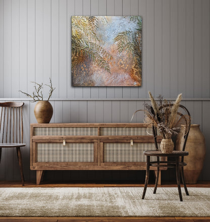 Sea grasses and rock pools in an oil painting. Shown on a grey panelled wall.