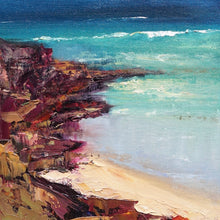 Load image into Gallery viewer, Abstract beach scene with buttercup coloured sand, turquoise ocean and reddish brown rocks in the corner of the beach. Square view.
