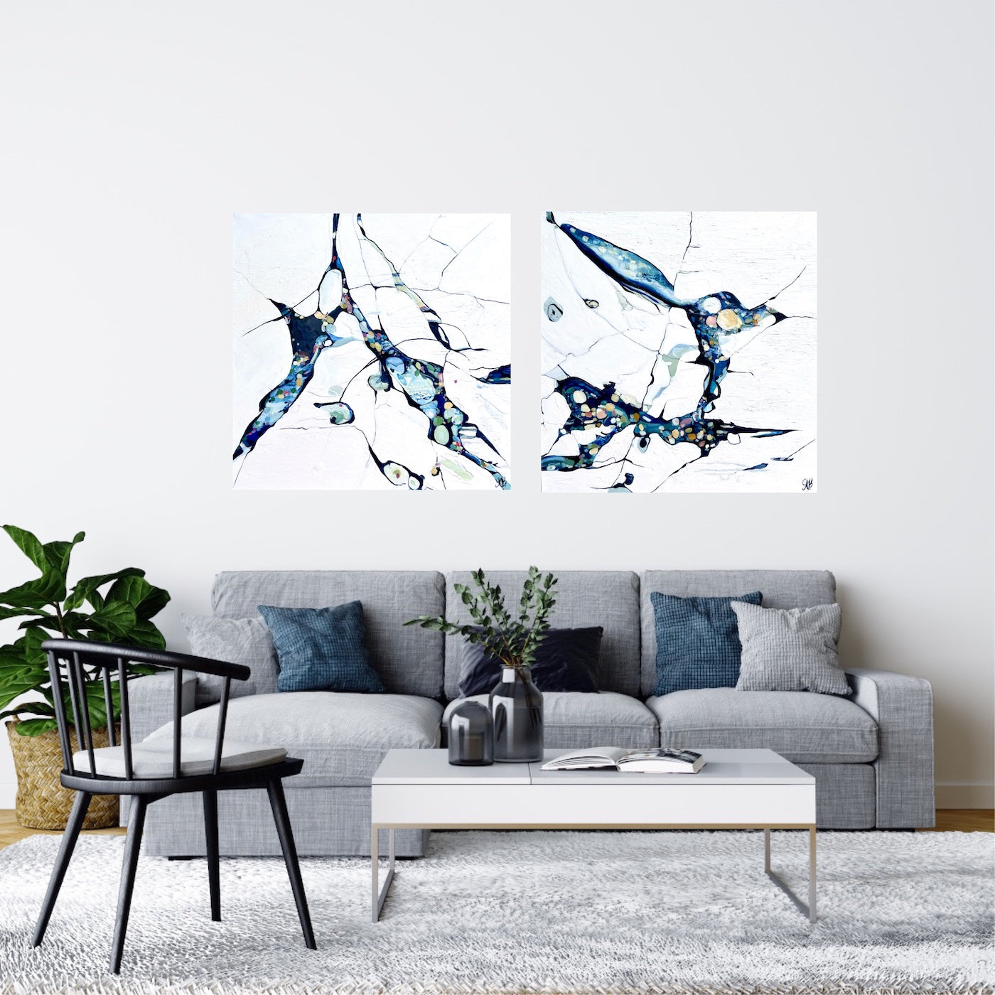 Abstract oil painting on a white background with blue, aqua, turquoise multi-coloured detail. In situ with matching painting.