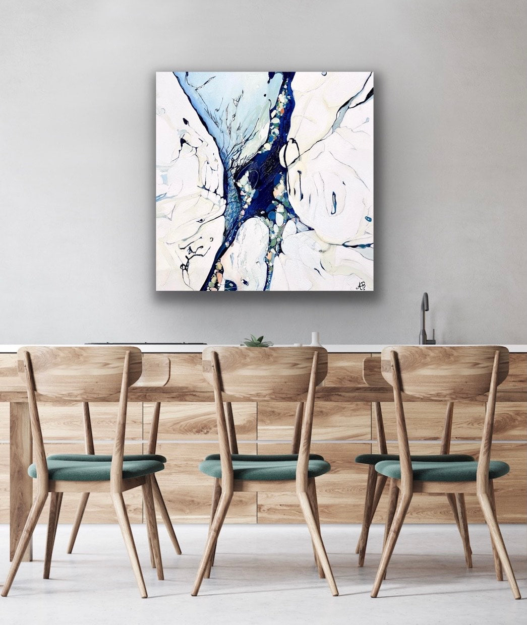 Abstract oil painting of ocean rock pools in shades of blue, aqua, rose pink, sage green and cream. Shown in situ on a pale grey dining room wall.