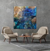 Load image into Gallery viewer, Abstract painting of an underwater scene in shades of aqua, blue and caramel. In situ on a siting room wall.
