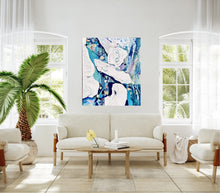 Load image into Gallery viewer, Abstract oil painting in white and blue with small multi-colours depicting stained glass. Shown in a living room next to an indoor palm.
