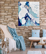 Load image into Gallery viewer, Abstract painting in white and blue with small multi-colours depicting stained glass. Shown on a brick wall.
