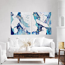 Load image into Gallery viewer, Abstract painting in white and blue with small multi-colours depicting stained glass. Shown on a white wall with a matching artwork.
