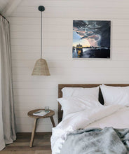 Load image into Gallery viewer, A motor boat berthed at a marina as a storm approaches with large charcoal grey storm clouds tinged with pink. In situ on a white panelled bedroom wall.
