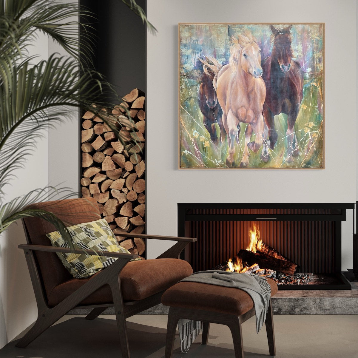 Two black horses and one caramel coloured horse in a multi-coloured pastel field. In situ above a fireplace.