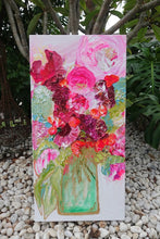 Load image into Gallery viewer, pink, red and pale green blooms in a tall pale green vase. in situ view.
