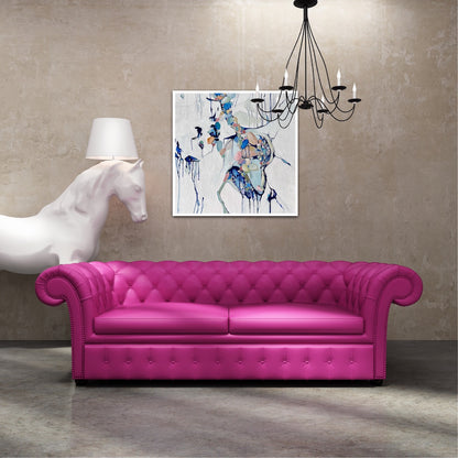 Abstract painting of a cluster of stones in a tidal pool with a background of mostly white with blues and multi coloured detail.  Shown on a wall above a hot pink sofa.