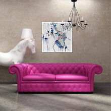 Load image into Gallery viewer, Abstract painting of a cluster of stones in a tidal pool with a background of mostly white with blues and multi coloured detail.  Shown on a wall above a hot pink sofa.
