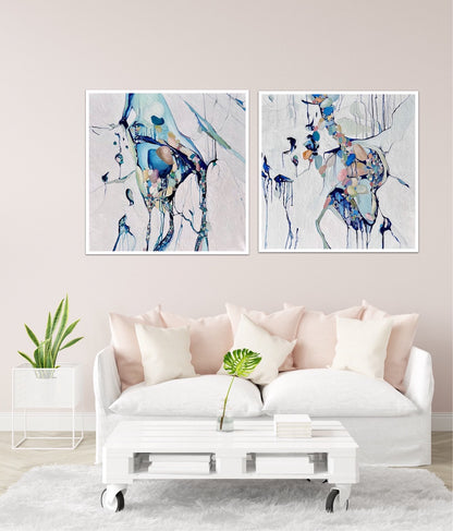 Abstract painting of a cluster of stones in a tidal pool with a background of mostly white with blues and multi coloured detail. Shown on a wall next to a matching artwork.