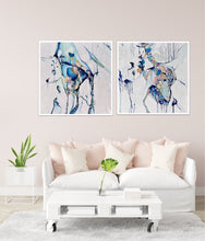 Load image into Gallery viewer, Abstract painting of a cluster of stones in a tidal pool with a background of mostly white with blues and multi coloured detail. Shown on a wall next to a matching artwork.
