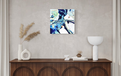 Contemporary abstract painting in shades of blue, aqua, turquoise, green, pink, ochre and white. Shown hanging on wall.