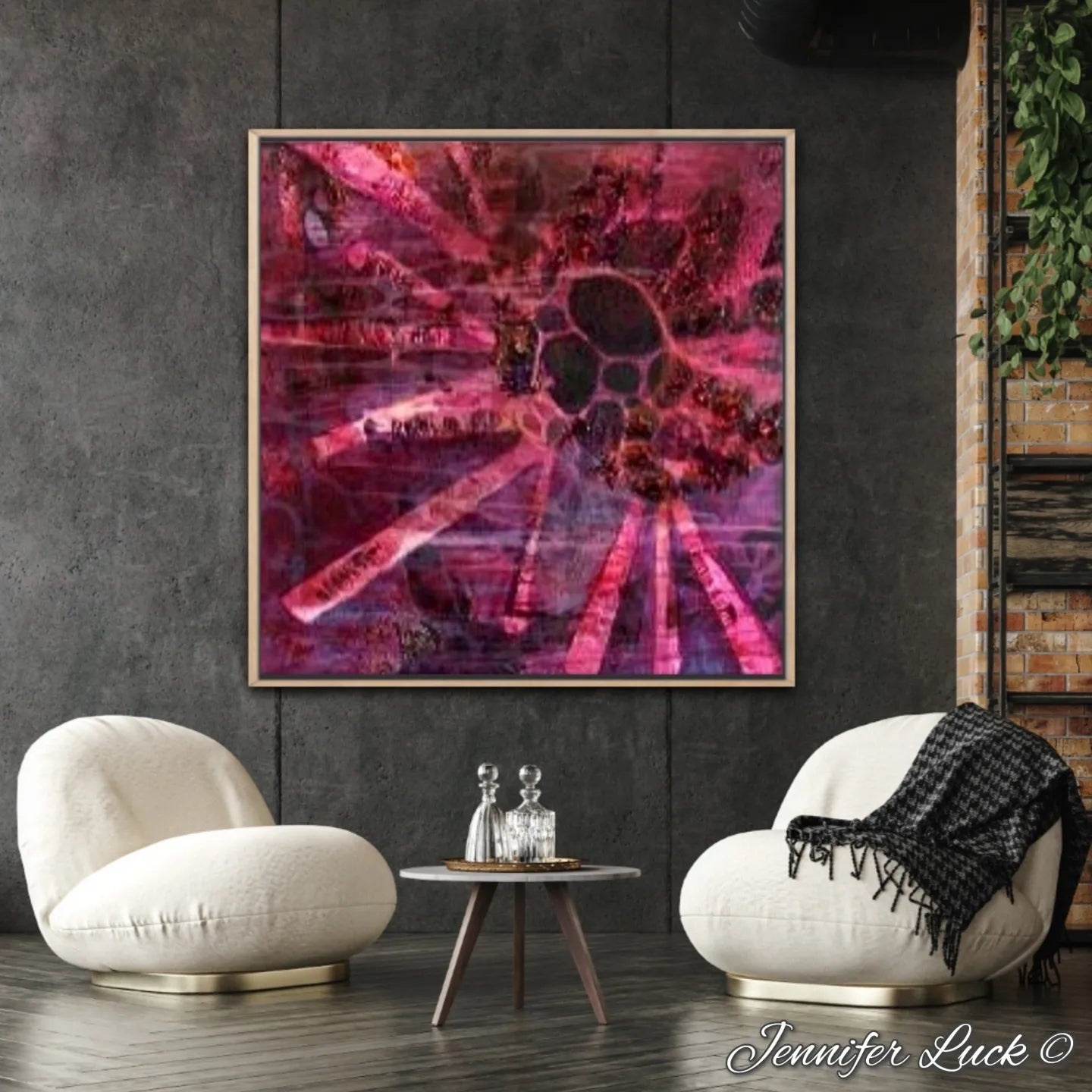 Crimson coloured abstract painting of a sea urchin. Shown framed in Tasmanian Oak on a dark grey wall.