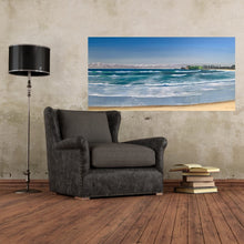 Load image into Gallery viewer, A large sweep of Werri Beach, Gerringong on the NSW South Coast, with Gerringong headland in the distance. Shown in situ on a living room wall.
