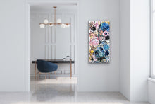 Load image into Gallery viewer, Multi-coloured abstract blooms on a cream background. In situ on a white wall.
