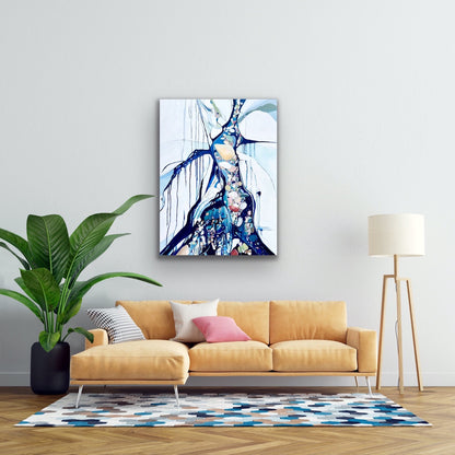Abstract rockpool in a myriad of shades including blue, white aqua turquoise and rose and pink.  Shown on a living room wall above a mustard coloured sofa.