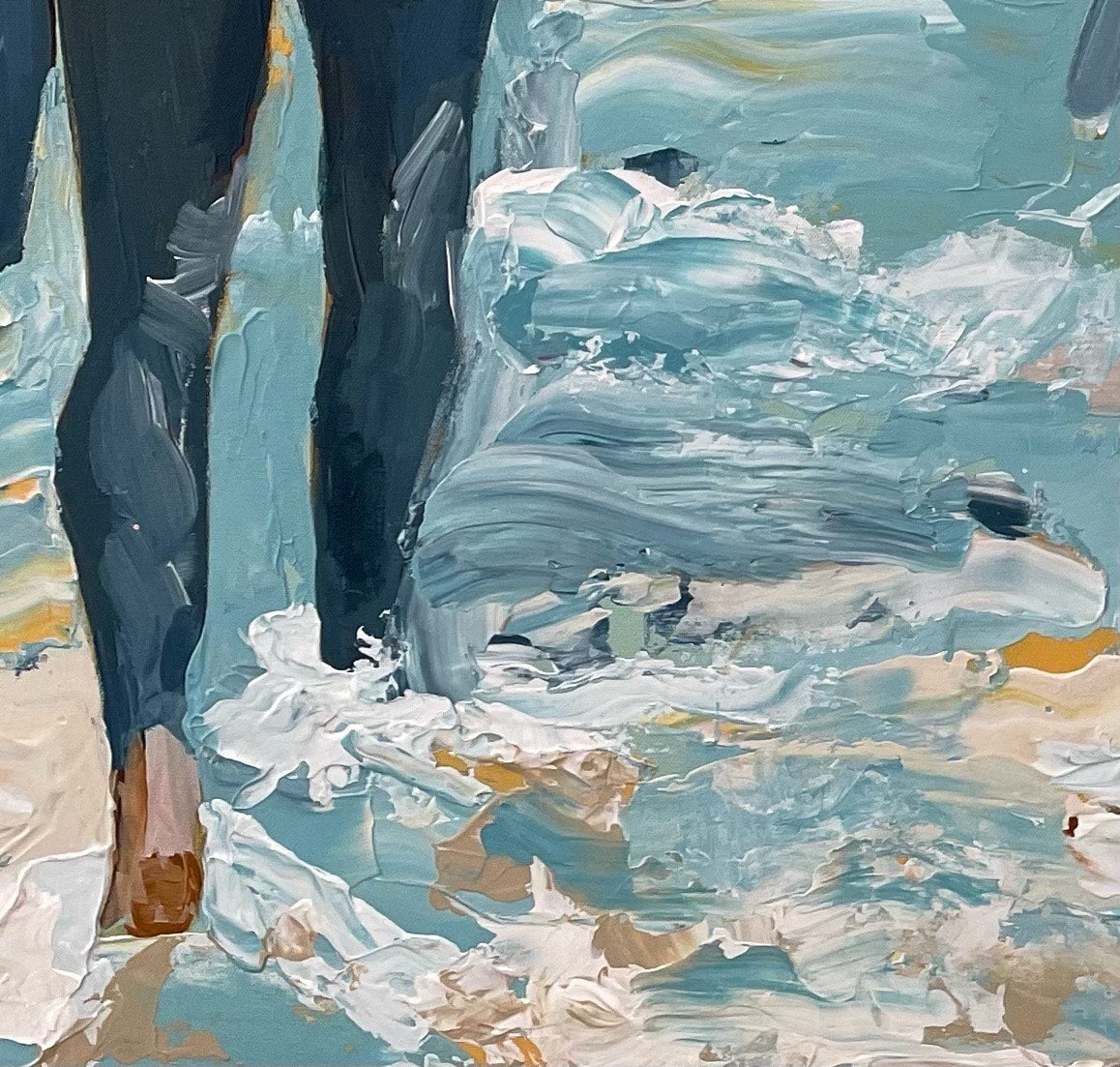 Surf painting with a man and woman standing on the edge of the ocean with surfboards under their arms. Shown here in close up view.