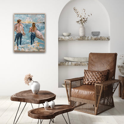 Surf painting with a man and woman standing on the edge of the ocean with surfboards under their arms. Shown on a white sitting room wall.