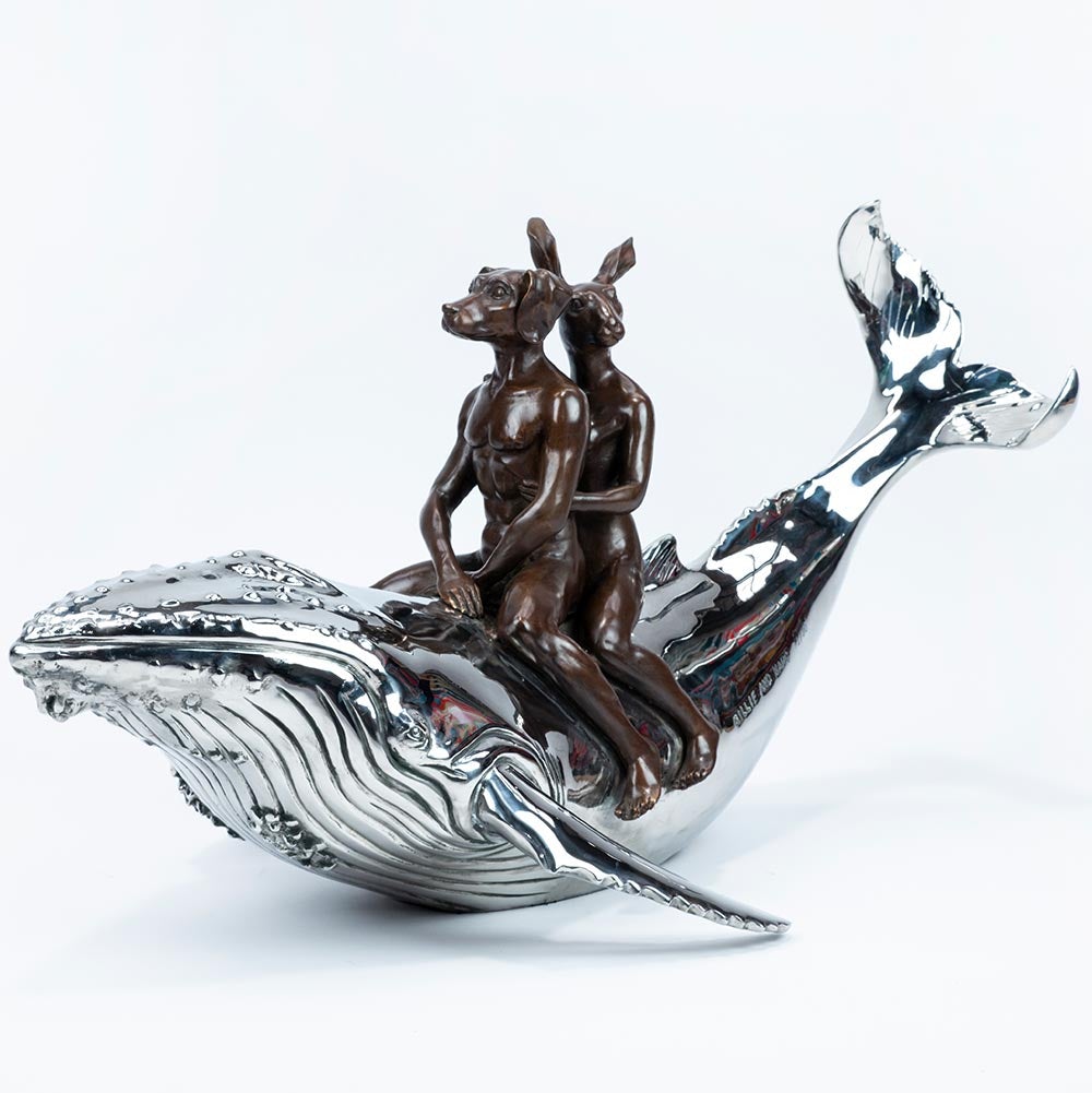 Bronze and stainless steel Sculpture of a dog man and rabbit woman riding on a whale.