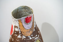 Load image into Gallery viewer, Hand crafted sculptural and functional ceramic vase in brown with touches of cream, coral red and green. Detail view.
